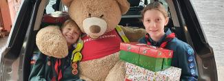 Scouts group dropping off shoeboxes