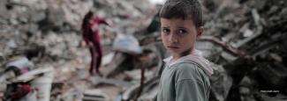 Boy amidst rubble