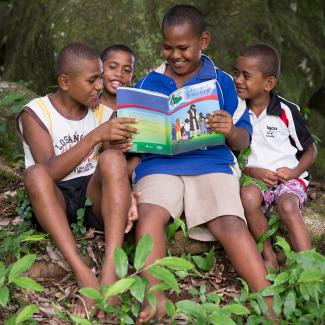 boys reading The Greatest Journey book