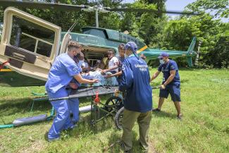 patient loading into helicopter