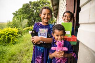 girls in fiji with gifts