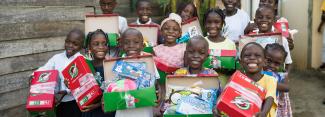children with shoeboxes
