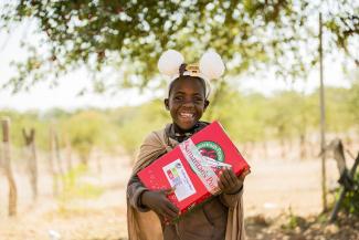 child with shoebox gift in Namibia