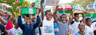 children celebrating receiving shoebox gifts
