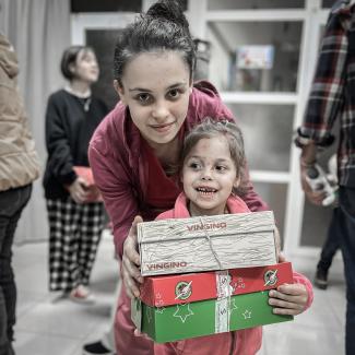 family with shoebox gifts