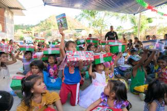 Excited children with their OCC shoebox in hand