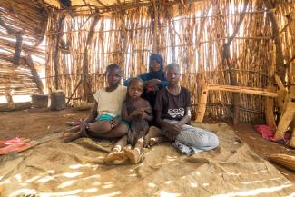 THE FAMILY OF FOUR LIVES WITH ANOTHER FAMILY IN A SINGLE-ROOM, STRAW HOME WHILE NADIA BUILDS HER HOUSE NEARBY. HOSPITALITY AND GENEROSITY ARE COMMON IN SUDANESE CULTURE, EVEN AMID DISASTER.
