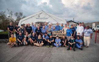Medical team in front of Emergency Field Hospital