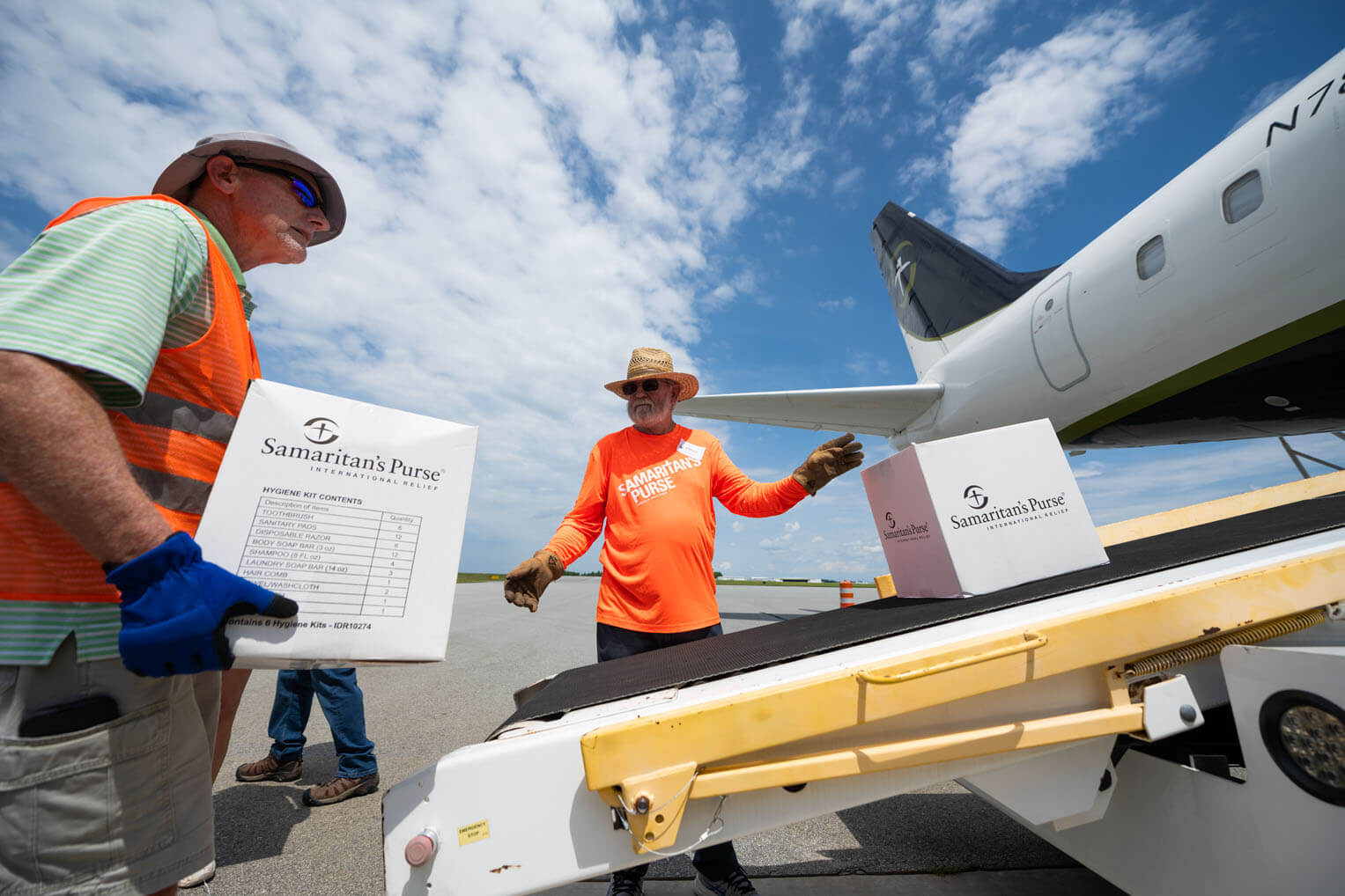 Staff load our DC-8 with supplies for our relief response in Hawaii where wildfires destroyed whole communities on Maui.