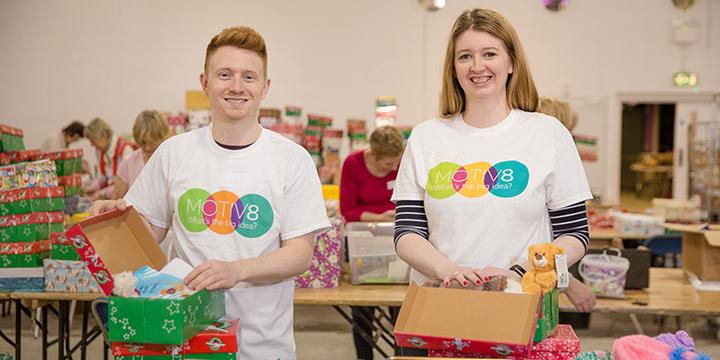 Colleagues volunteering at a processing centre