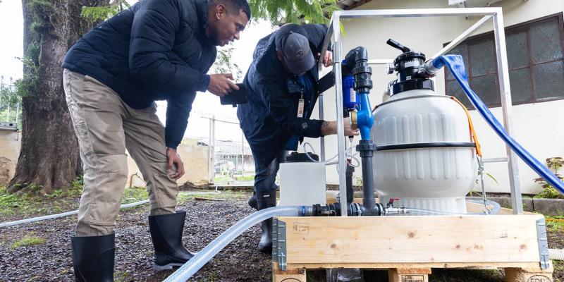 A Samaritan's Purse team installs a community water filtration system. Most of the local population still have no access to clean water. 