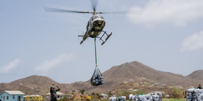 SAMARITAN’S PURSE IS SLING LOADING SUPPLIES FROM OUR HELICOPTER TO PETITE MARTINIQUE.