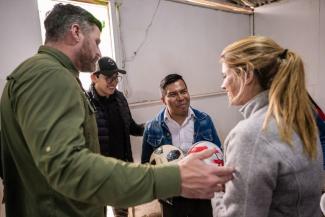 Pastor Elfren delights in receiving soccer balls from the Grahams that will equip him in ministry to his community as Andres Almeida, Operation Christmas Child regional manager for South America, translates for the trio.