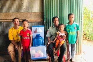 Members of Sida’s family gratefully stand with their new bio-sand filter—one of 31,000 Samaritan’s Purse has distributed in Cambodia over the last 17 years.