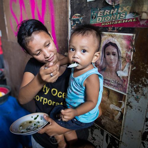 mother feeding child